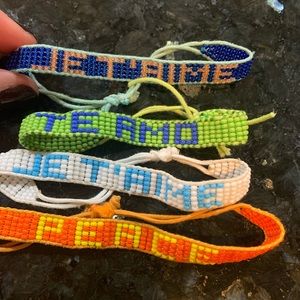 Set of four Ubuntu bracelets - various colors of beaded bracelets